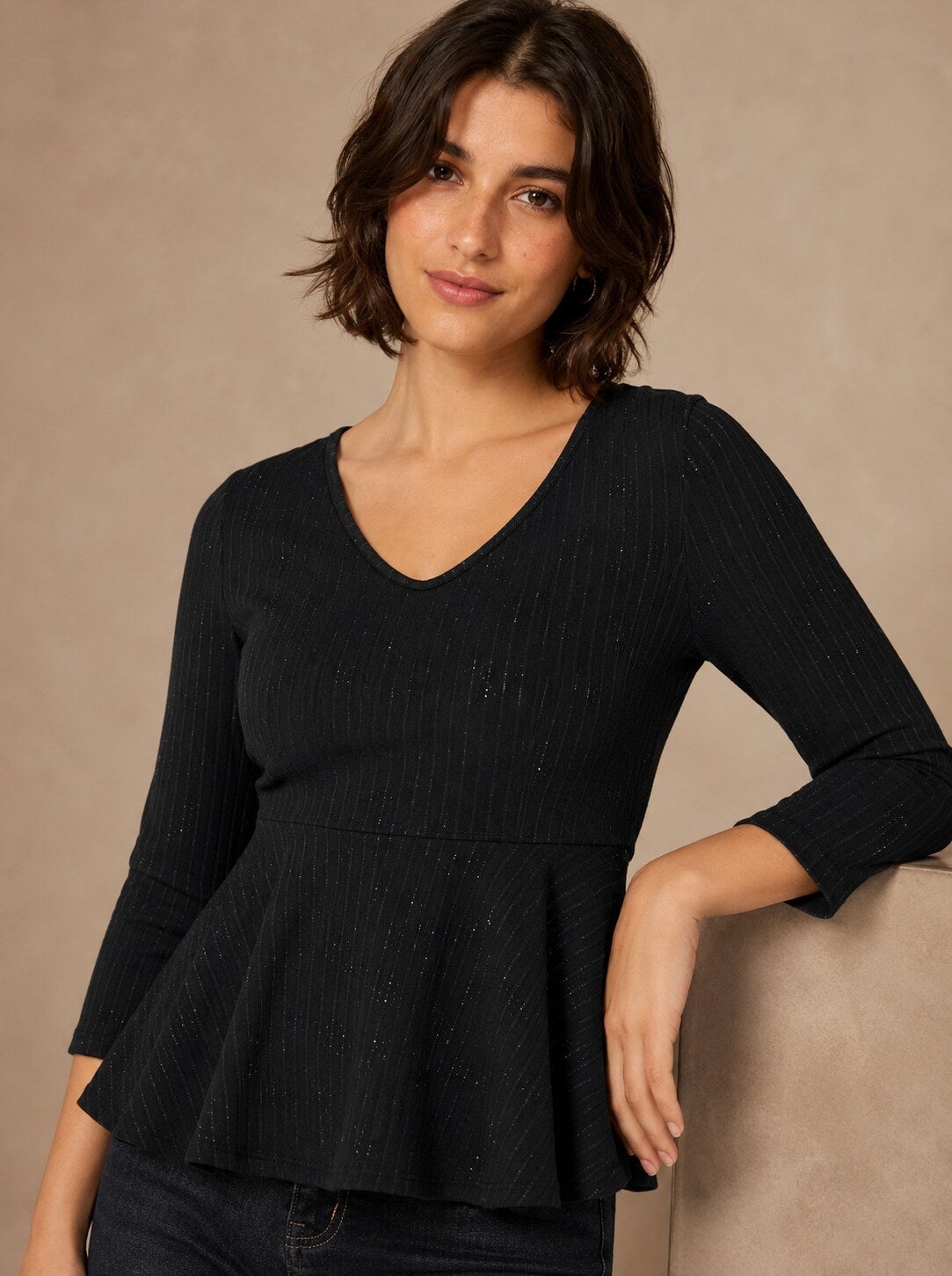 Camiseta peplum negra de manga larga con hilos de lúrex Las Palmas de LYLU - frontal